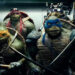 Raphael, Donnie, Mikey, and Leo in an elevator in "Teenage Mutant Ninja Turtles" (2014)