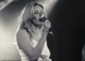 Chris Martin and Gwyneth Paltrow 's daughter Apple has released a new music video after her debut was slammed as an 'off-key drunken karaoke performance'