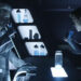 Michael Sheen as Castor drinking with Garrett Hedlund's Sam Flynn in Tron: Legacy