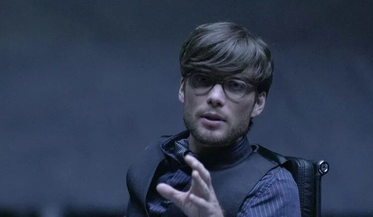 Ed Dillinger Jr. asks for calm during a tense moment in Tron: Legacy