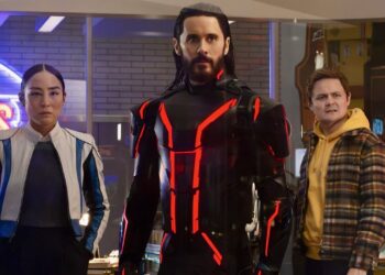 This image released by Disney shows Greta Lee, from left, Jared Leto and Arturo Castro in a scene from "Tron: Ares." (Disney via AP)