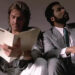 Don Johnson as Sonny Crockett and Philip Michael Thomas as Ricardo Tubbs sit next to each other in Miami Vice