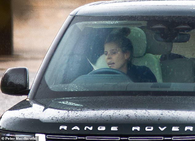 Princess Beatrice drives from Royal Lodge, home of her father Prince Andrew and mother Sarah Ferguson, at Windsor in Berkshire today