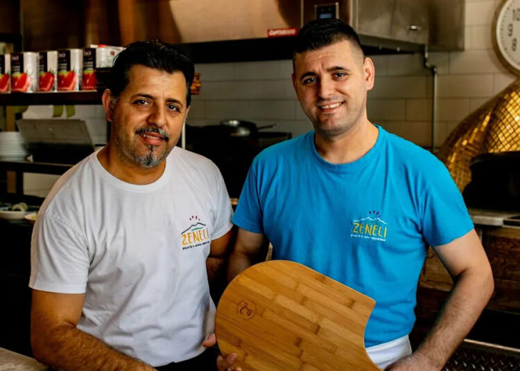 Brothers Jeshar, left, and Gazmir Zeneli at their New Haven pizzeria. (Lisa Nichols/Hearst CT Media)