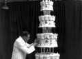 A man working on a wedding cake