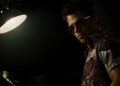 Tyler Durden in a dingy bedroom in Foght Club