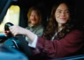 Emma Stone and Jesse Plemons in a car together in Bugonia. .