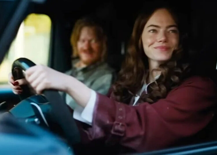 Emma Stone and Jesse Plemons in a car together in Bugonia. .