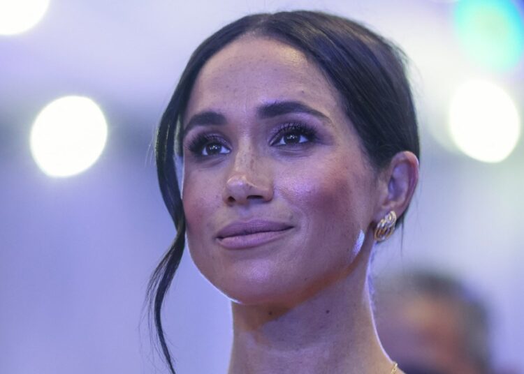 Camera Captures Eye-Catching Photo of a Coy Meghan Markle