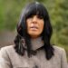 Claudia Winkleman wearing a jacket while standing outside in the Scottish Highlands, filming the Celebrity Traitors
