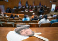 A cut out of the late Greg Mudge sits on a ledge as Detroit City Council holds a vote to decide honorary secondary street names for legendary Detroiters at the Coleman A. Young Municipal Center on Tuesday, Oct. 28, 2025 which included Mudge the late owner of Mudgie's Deli and Wine Shop in Corktown.