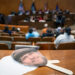 A cut out of the late Greg Mudge sits on a ledge as Detroit City Council holds a vote to decide honorary secondary street names for legendary Detroiters at the Coleman A. Young Municipal Center on Tuesday, Oct. 28, 2025 which included Mudge the late owner of Mudgie's Deli and Wine Shop in Corktown.
