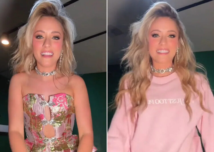 Country Singer Emily Ann Roberts Avoids Wardrobe Malfunction by Throwing on a Sweatshirt to Perform