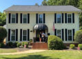 Molly Fracasso Molly and Paul Fracasso in front of their new home in North Carolina.