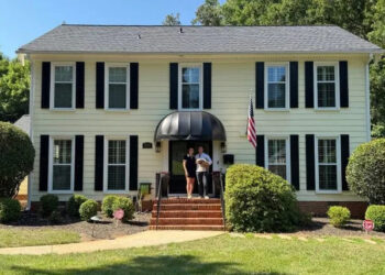 Molly Fracasso Molly and Paul Fracasso in front of their new home in North Carolina.