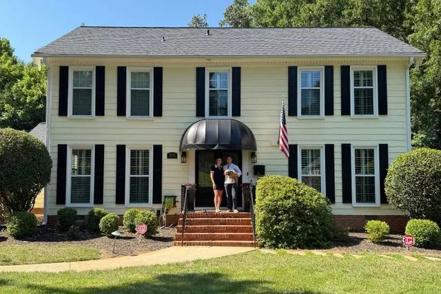 Molly Fracasso Molly and Paul Fracasso in front of their new home in North Carolina.