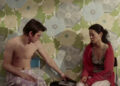 Josh Hartnett as Slevin Kelevra and Lucy Liu as Lindsey sitting by the phone and staring at it in Lucky Number Slevin