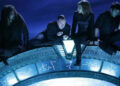 Ronon, Rodney, Teyla, and Sheppard are forced to climb the Stargate after an accident in Stargate Atlantis