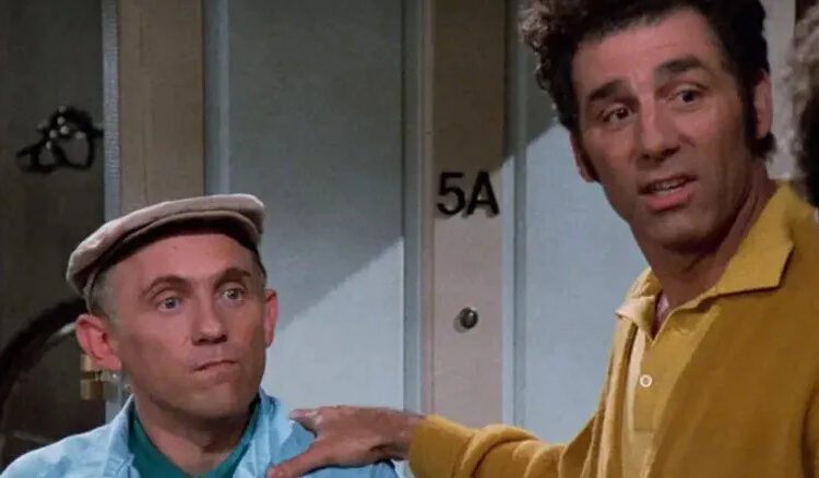 Kramer with his hand on Stan's shoulder on Seinfeld