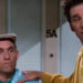 Kramer with his hand on Stan's shoulder on Seinfeld