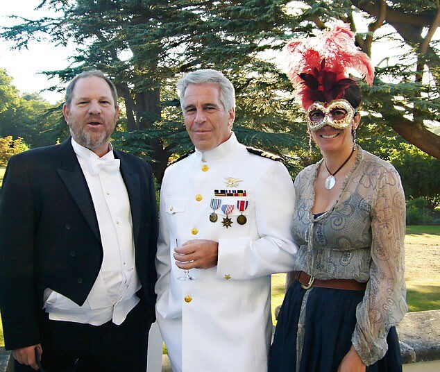 In the picture taken at Royal Lodge Harvey Weinstein is wearing a coat and tails while Jeffrey Epstein is dressed up in US military uniform clutching a wine glass and Ghislaine Maxwell an be seen wearing a feathered boa mask while grinning for the camera