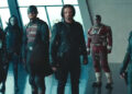 thunderbolts, a group of characters in combat outfits standing in a modern high rise building