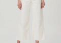 A model wearing white wide leg Paige jeans