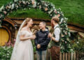Hobbiton Movie Set; Cath Ullyett Sharik and Jessica Burgess-Stride with Elijah Wood