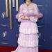 Renowned actress Parker Posey, 56, who most recently appeared in The White Lotus, arrived in an old fashioned frilly, tiered lilac gown that featured long sleeves and a sheer mini cape with a fur hem