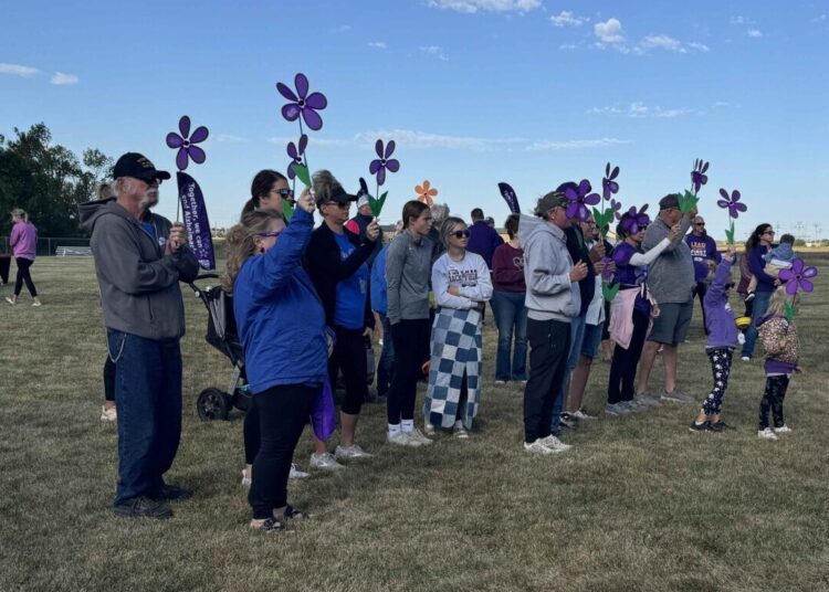 Different colored flowers were handed out to those who participated in 2024 Walk To End Alzheimer's, with each color honoring a different aspect of the fight against the disease. The event was Saturday, Sept. 21 at the Strode Center. Aberdeen Insider photo by Shannon Marvel.