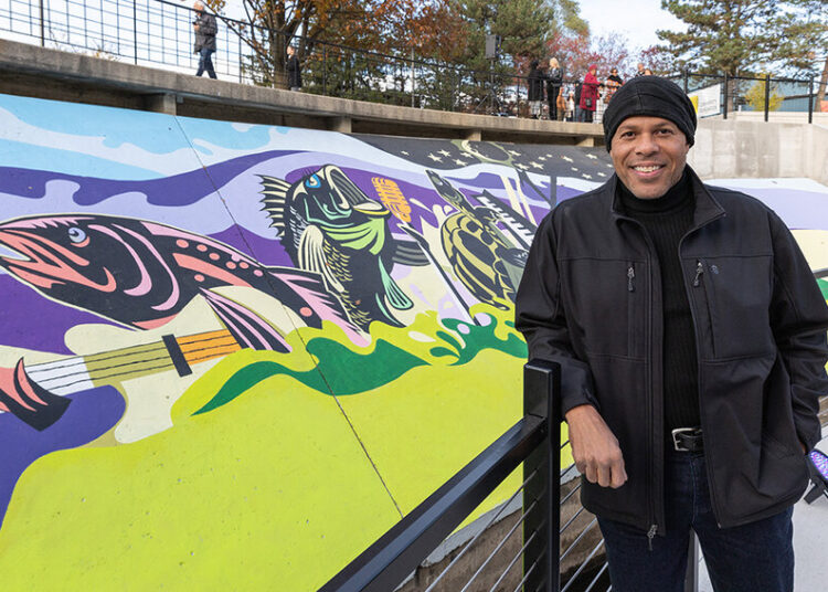 Local muralist Brian Whitfield learned to rappel to paint this piece.