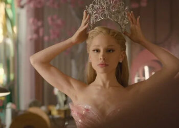 Ariana Grande as Elphaba putting on her crown in Wicked: For Good