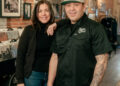 Migraine-free since the switch to sake, says Michelle pictured here with Albert, at Reverie in Roseburg. (Photo by Sierra and Isaiah Miller)