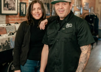 Migraine-free since the switch to sake, says Michelle pictured here with Albert, at Reverie in Roseburg. (Photo by Sierra and Isaiah Miller)
