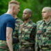 Max Parker as Sgt. Sullivan and Miles Heizer as Cameron in Boots
