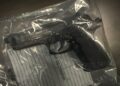 A replica handgun in a plastic bag
