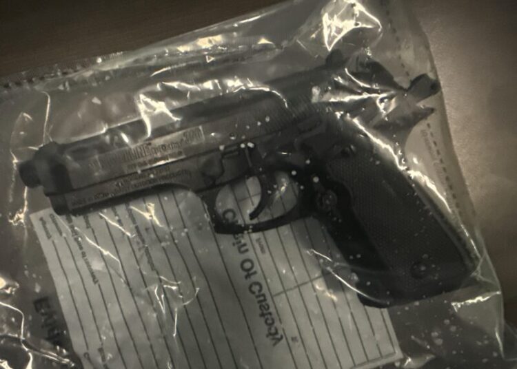 A replica handgun in a plastic bag