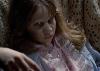 A possessed Regan lying down in The Exorcist