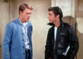 Ron Howard's RIchie Cunningham talks to Henry Winkler's Arthur Fonzarelli in a bathroom in Happy Days