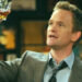 Barney holding up a scotch in How I Met Your Mother