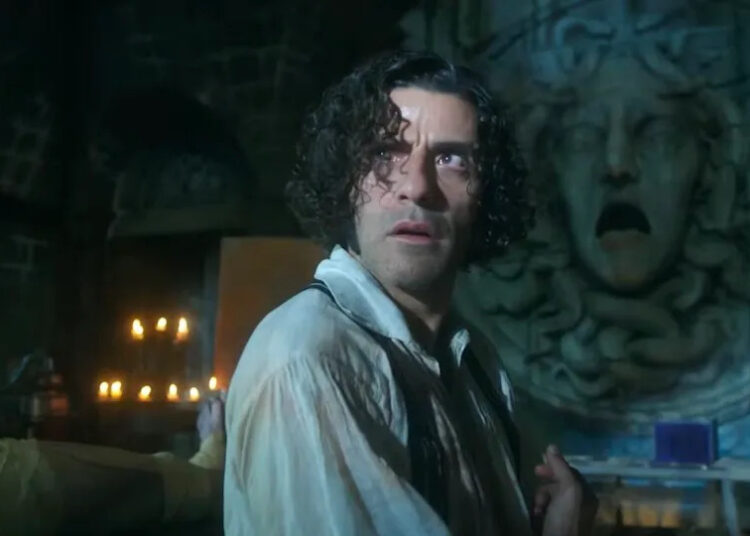 Oscar Isaac's Victor Frankenstein looking up in horror as lightning flashes.