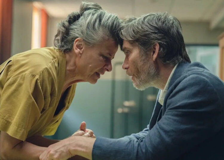 (L to R) Tracey Ullman as Amanda putting her forhead against Cillian Murphy as Steve.