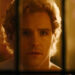 A college student looking through a door in True Haunting.