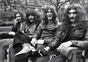 Black Sabbath in 1970, sitting on a park bench.