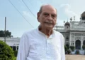 Aman/BBC Faiyaz Ali Khan stands in front of the Bara Imambara in Lucknow