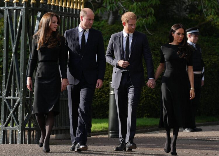 The Prince and Princess of Wales along with Prince Harry and Meghan Markle the Duke and Duchess of Sussex view the tributes at Windsor