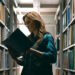 Mia Brennan amidst library stacks in Shelby Oaks