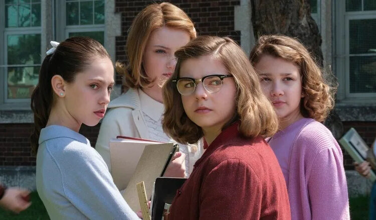 Group of young girls looking suspicious in It: Welcome to Derry