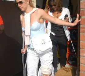 Bauer-Griffin/GC Britney Spears walks on crutches in Los Angeles in 2004