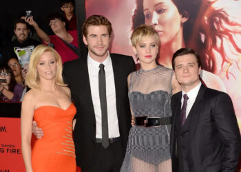 Actors Elizabeth Banks, Liam Hemsworth, Jennifer Lawrence and Josh Hutcherson arrive at the premiere of Lionsgate's "The Hunger Games: Catching Fire" at Nokia Theatre L.A. Live on Tuesday, Nov. 18, 2013 in Los Angeles.